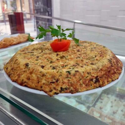 Tortilla de patatas, bacalao y cebolla